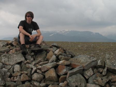 Ross on Beinn Udlamain summit with Ben Alder in the background.jpg
