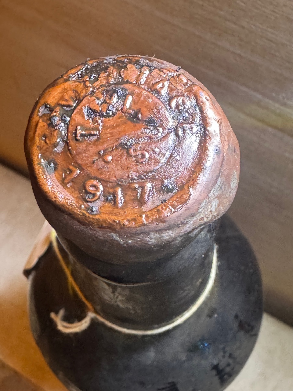 Clear wax seal identifies the bottle